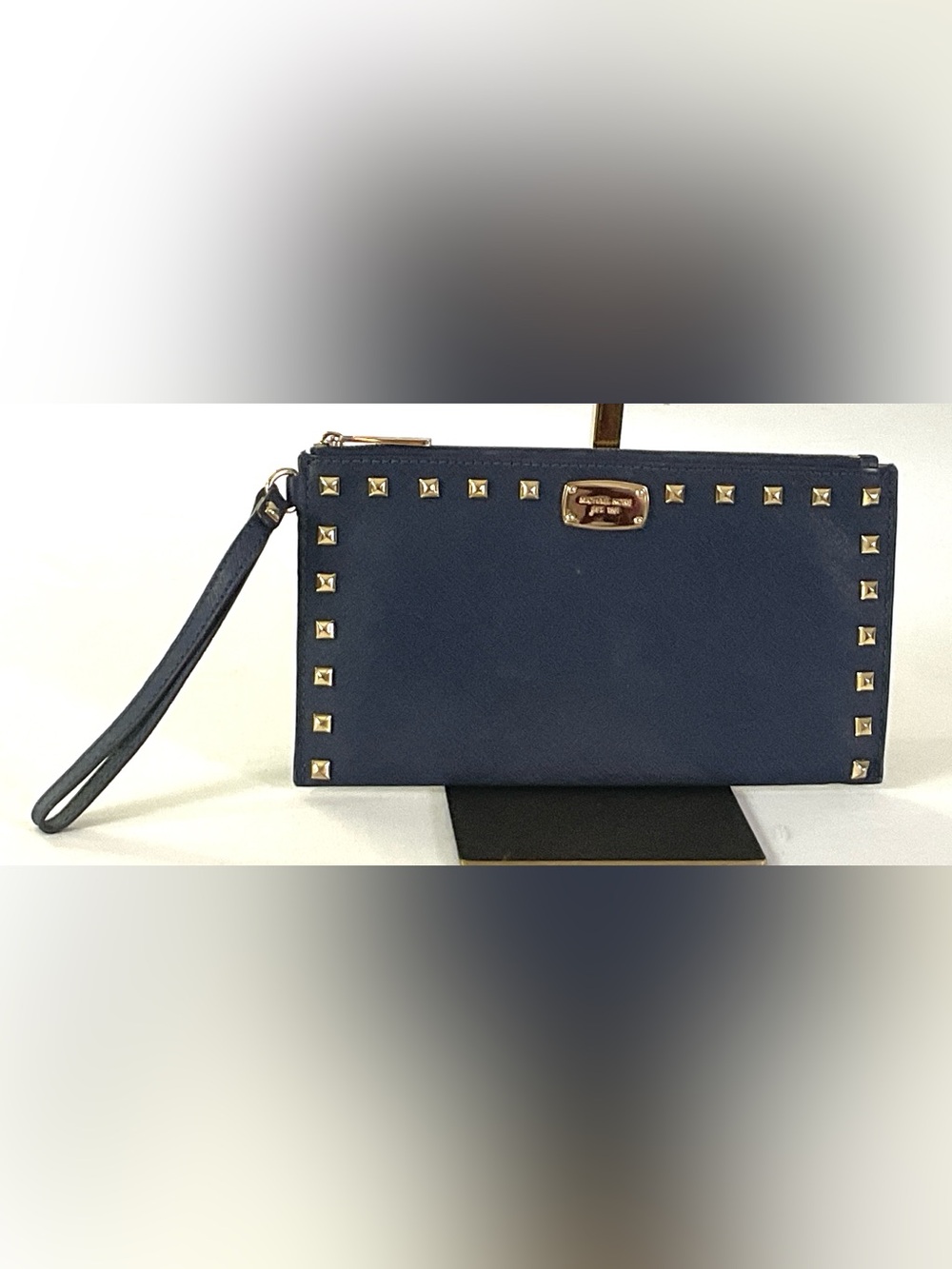 Michael Kors-navy blue saffiano leather, pyramid, gold studs zip wristlet/clutch